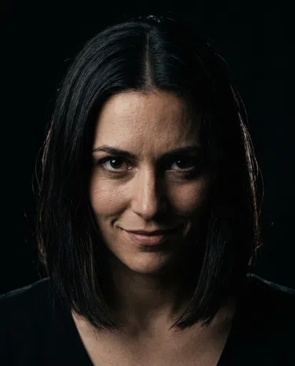 Dark Haired Woman With Menacing Smile