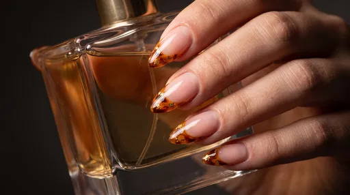 Tortoiseshell French Manicure Holding Perfume Bottle