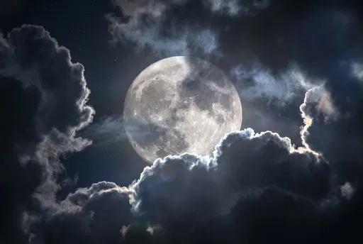 Full Moon Behind Dark Storm Clouds