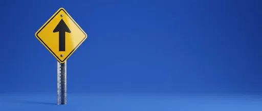 Yellow Upward Arrow Road Sign on Blue