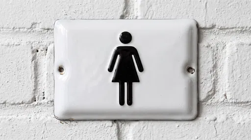 White Enamel Women's Restroom Sign