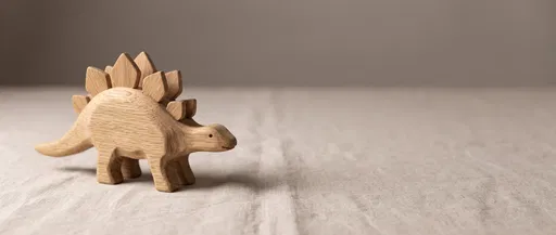 Handcrafted Wooden Stegosaurus Toy on Linen
