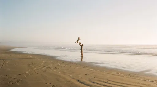 Father Tossing Toddler on Sunny Beach