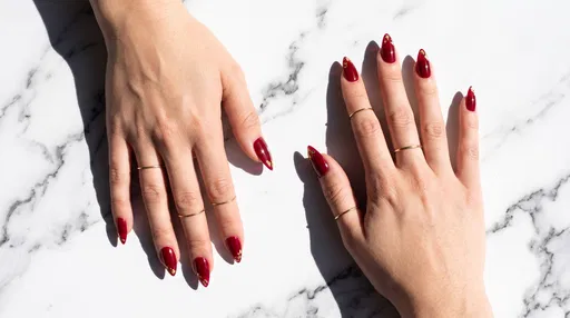 Manicured Hands With Ruby Stiletto Nails