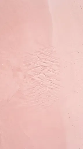 Pastel Pink Wet Beach Sand Texture