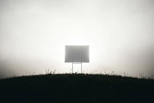 Blank Yard Sign on Dark Hilltop