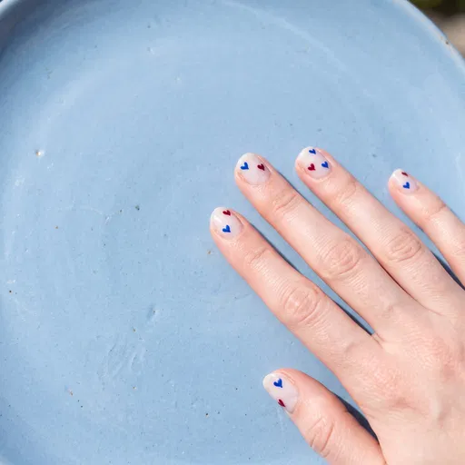 Heart Nail Art on Blue Ceramic