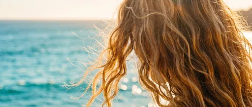 Sunlit Wavy Blonde Hair by Ocean