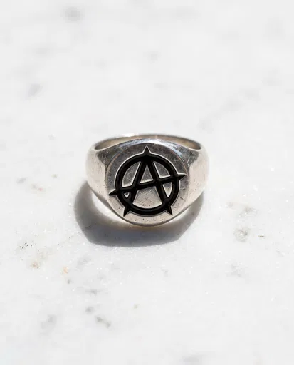 Silver Anarchy Signet Ring on Marble