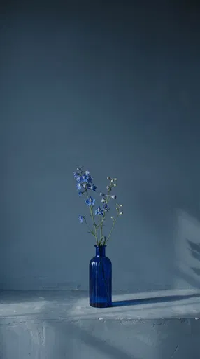 Blue Delphiniums in Cobalt Glass Vase