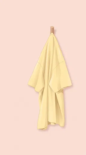 Yellow Oversized Shirt Hanging on Peg