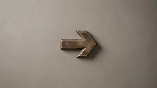 Brushed Bronze Arrow on Gray Wall