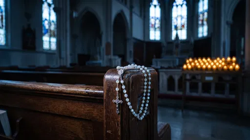 Pearl Rosary on Wooden Church Pew