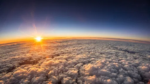Golden Sunset Above Fluffy Clouds