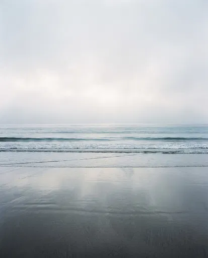 Minimalist Foggy Ocean Horizon and Wet Sand