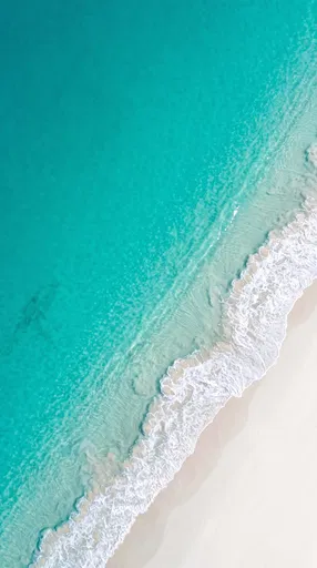 Aerial View of Turquoise Ocean Beach