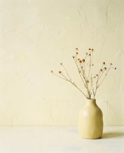Dried Chamomile in Yellow Ceramic Vase