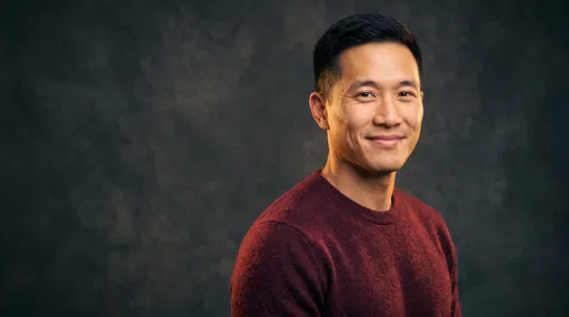 Smiling East Asian Man Studio Portrait