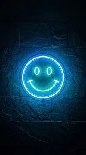 Blue Neon Smiley Sign on Slate Wall