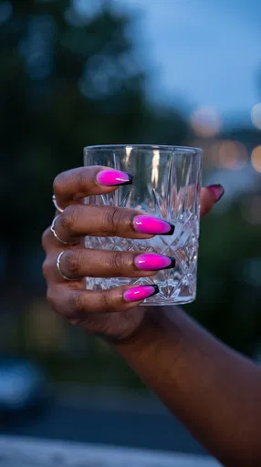 Hand With Neon Pink Coffin Nails