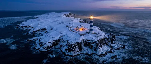 Blue Striped Lighthouse on Snowy Peninsula