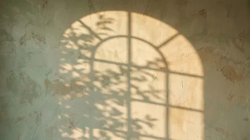Arched Window Shadow on Textured Wall