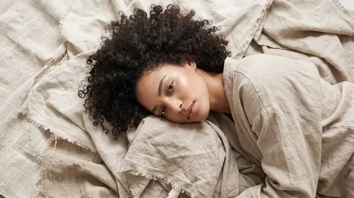 Woman Resting on Neutral Linen Textiles