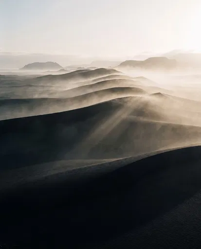 Misty Black Sand Dunes at Sunrise