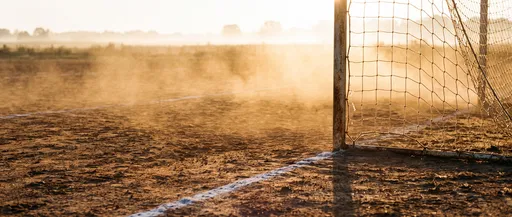 Dusty Rural Soccer Goal at Sunrise