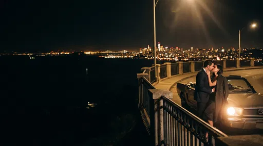 Couple Kissing by Classic Convertible at Night