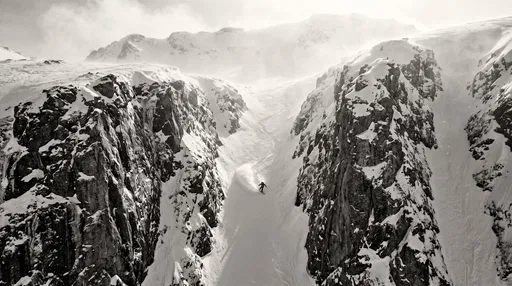Monochrome Aerial View of Couloir Snowboarder