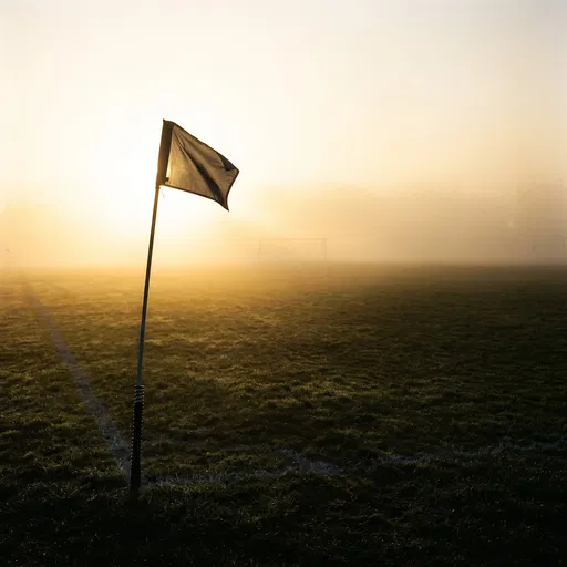 Corner Flag on Foggy Football Pitch
