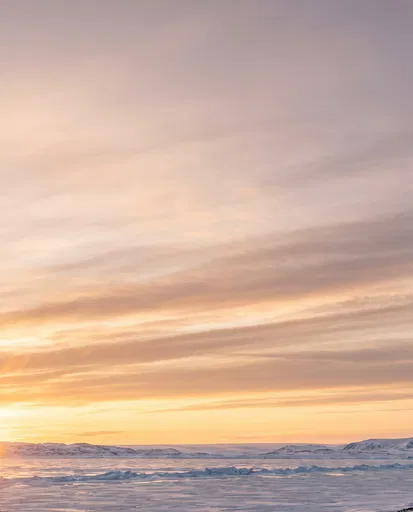 Pastel Dawn Over Frozen Polar Landscape