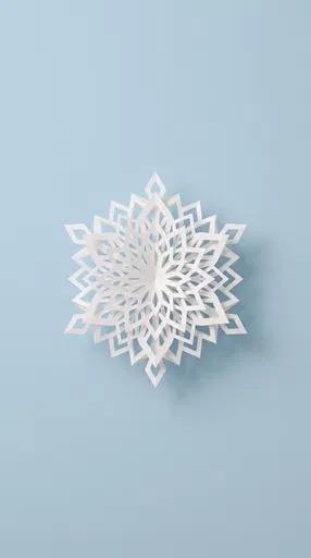 White Paper Snowflake on Blue Background