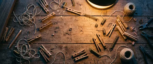 Wooden Clothespins and Twine on Rustic Workbench