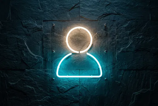 Glowing Neon Person Icon on Slate Wall