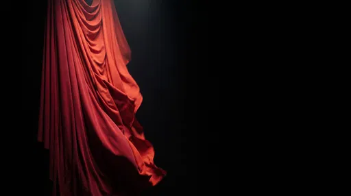 Crimson Fabric Drape on Black Background