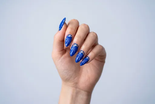 Hand With Blue Seashell Nail Art