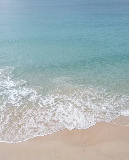 Aquamarine Ocean Waves on Pale Sand