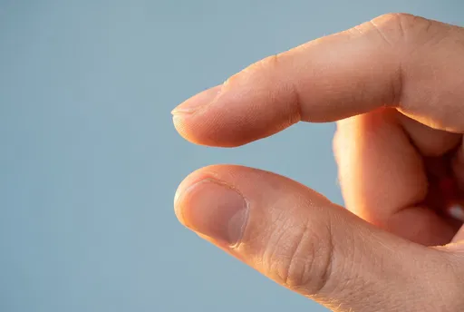Macro Close-Up of Fingers Pinching