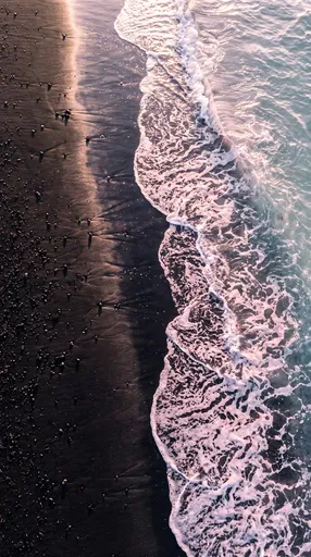Overhead View of Black Sand Beach Surf