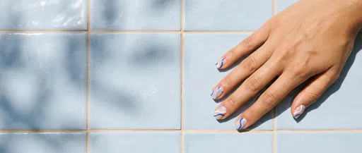 Hand With Blue Wavy Nail Art