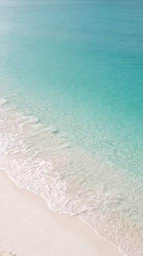 Turquoise Ocean Waves on White Sand