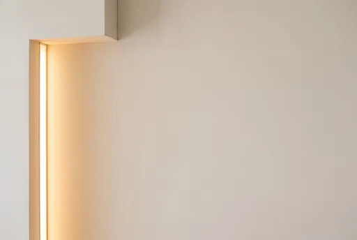 Minimalist Ivory Wall With Recessed Warm Light