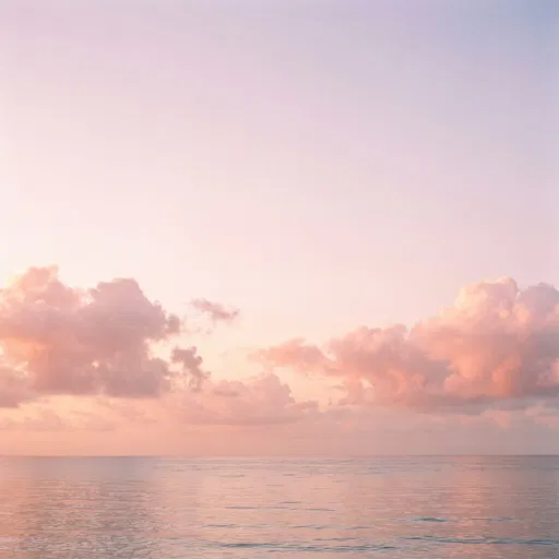 Pastel Dawn Clouds Over Calm Ocean