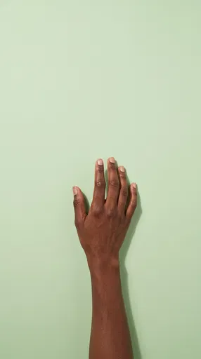 Outstretched Hand on Pastel Green Background