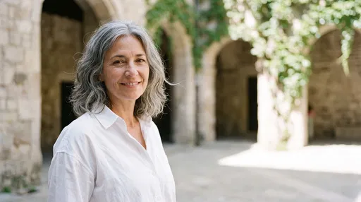 Smiling Mature Woman in Stone Courtyard