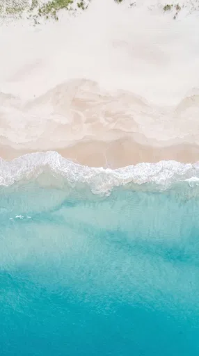 Aerial View of Turquoise Ocean and Beach