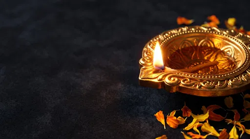 Golden Diya Lamp With Marigold Petals