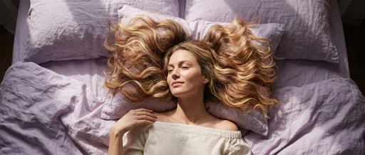Blonde Woman Reclining on Lavender Linen Bedding